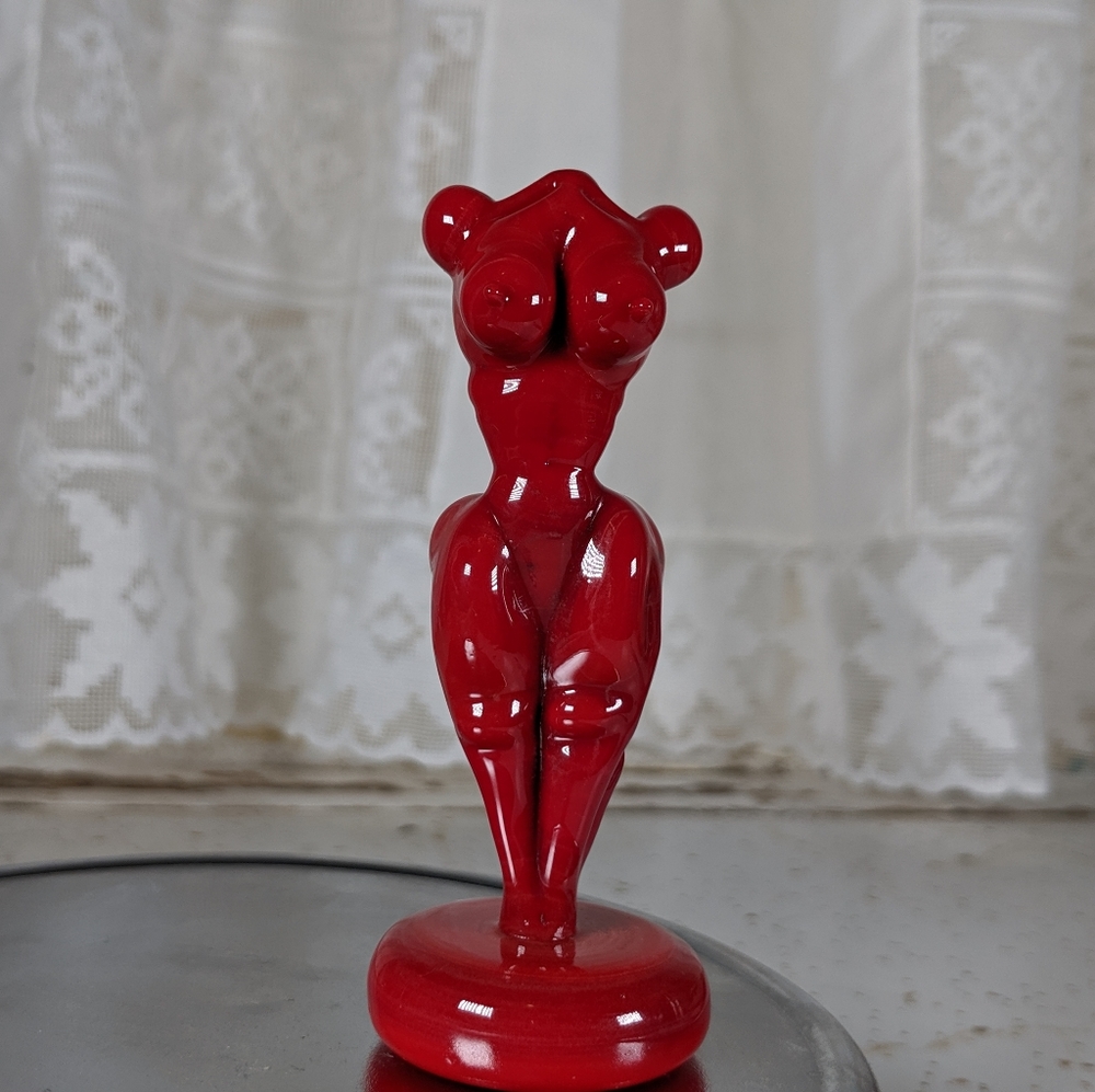 Red nude female figure sculpture